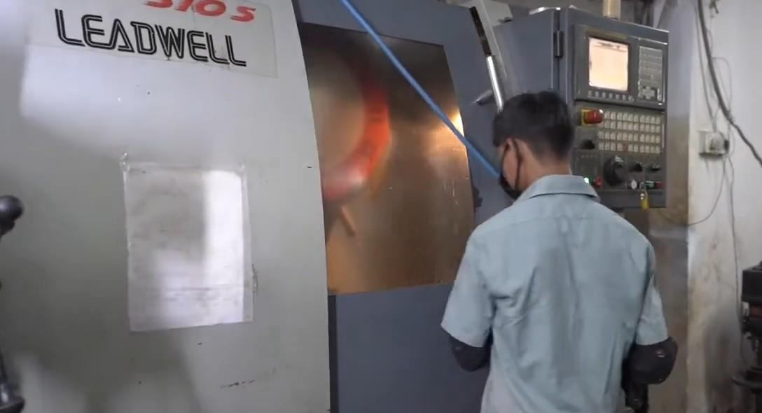 Operator at a Leadwell CNC machine