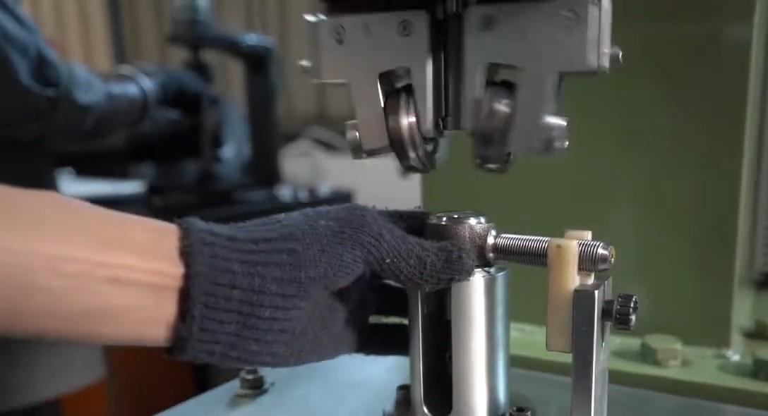 Orbital clamping of a tie rod end
