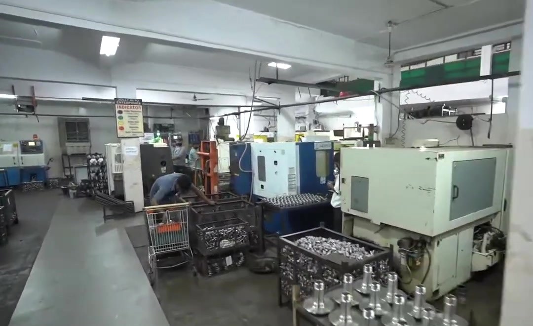 CNC machines along the main aisle of the machine shop