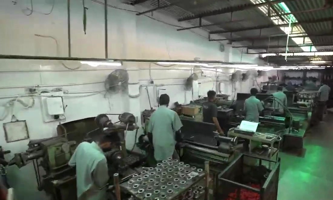 Operators at lathes in the machine shop