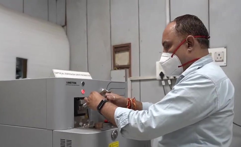 An operator running a sample on the optical emission spectrometer